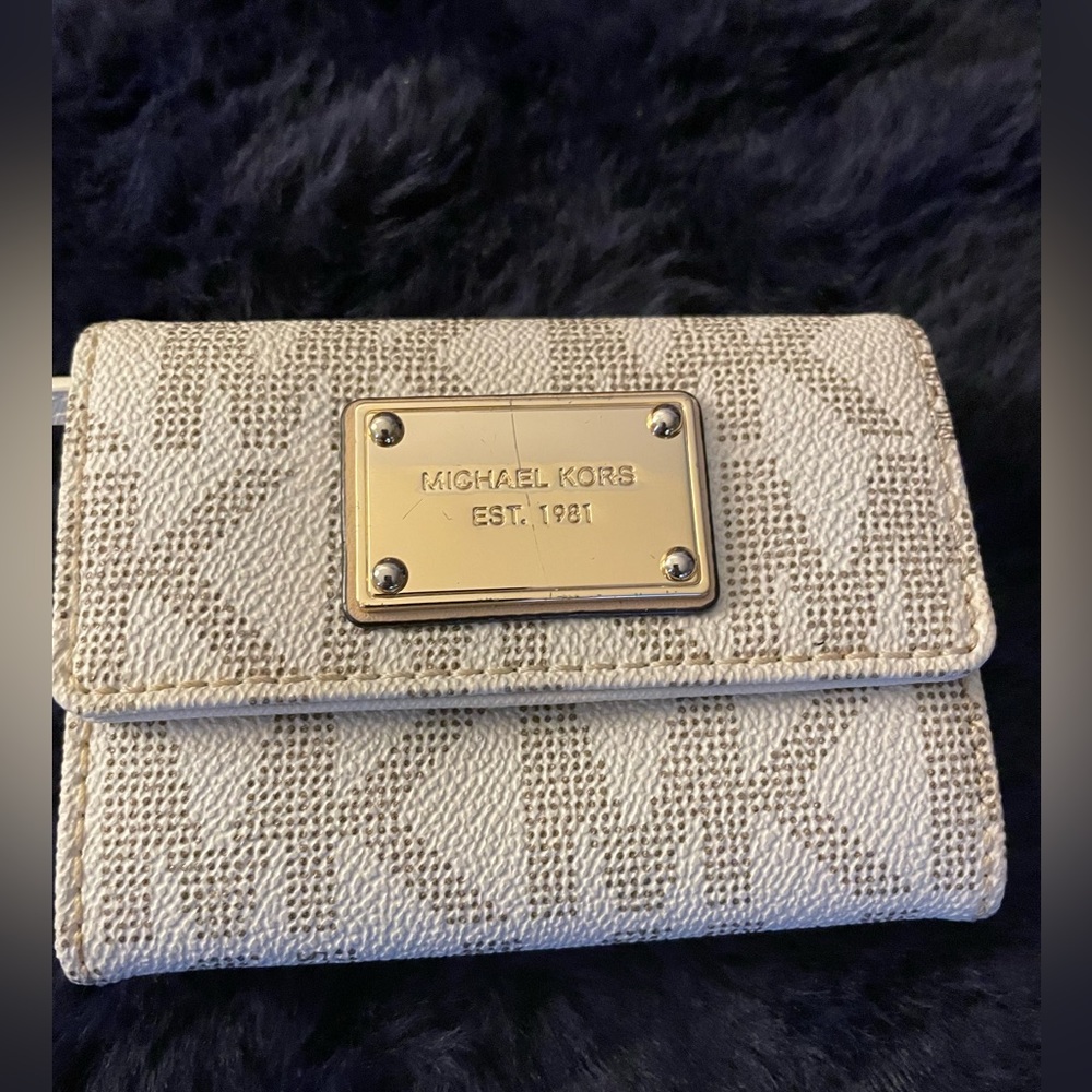 Michael Kors small white leather MK wallet.